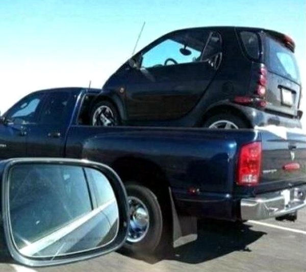 pick-up-truck-hauling-smart-car.jpg